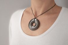 beautiful round pendant with radiation protection on the neck
